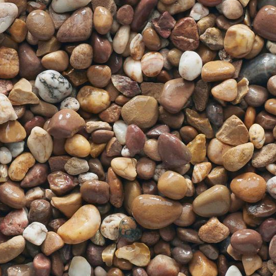 Close-up view of a collection of smooth, rounded, multicolored pebbles; shades of brown, beige, and white.