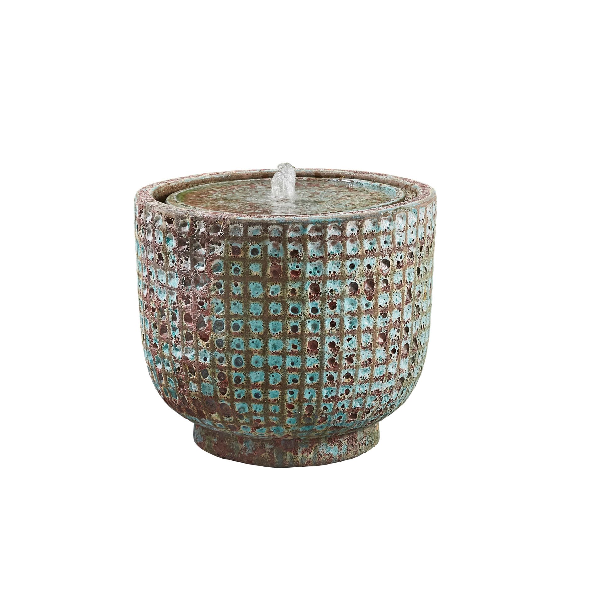 Water fountain with turquoise and brown textured ceramic.