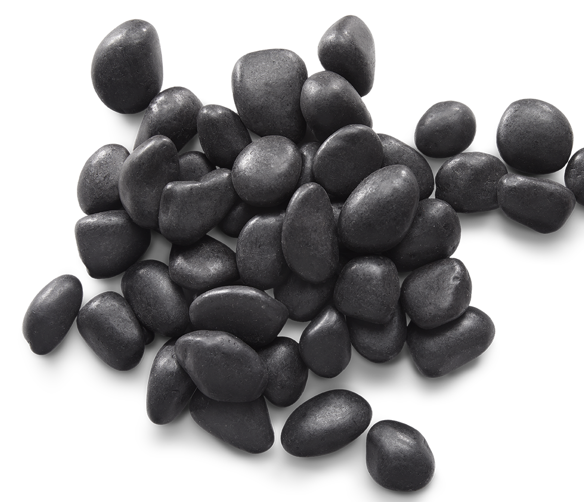 Pile of smooth, dark gray river rocks on a white surface.