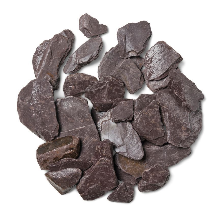 Pile of dark reddish-brown slate rocks against a white background.
