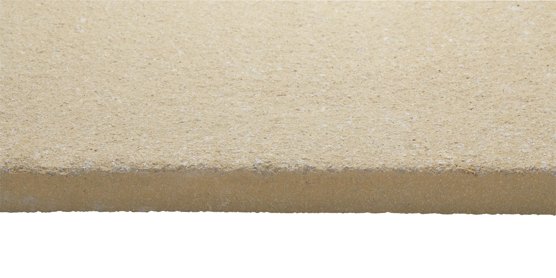 Close-up of a beige, textured, rectangular building material with a rough surface, possibly concrete or stone.