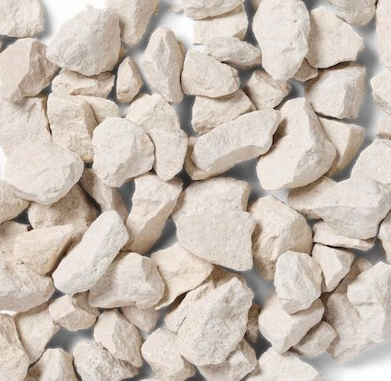White decorative gravel stones, roughly textured, scattered on a white surface.
