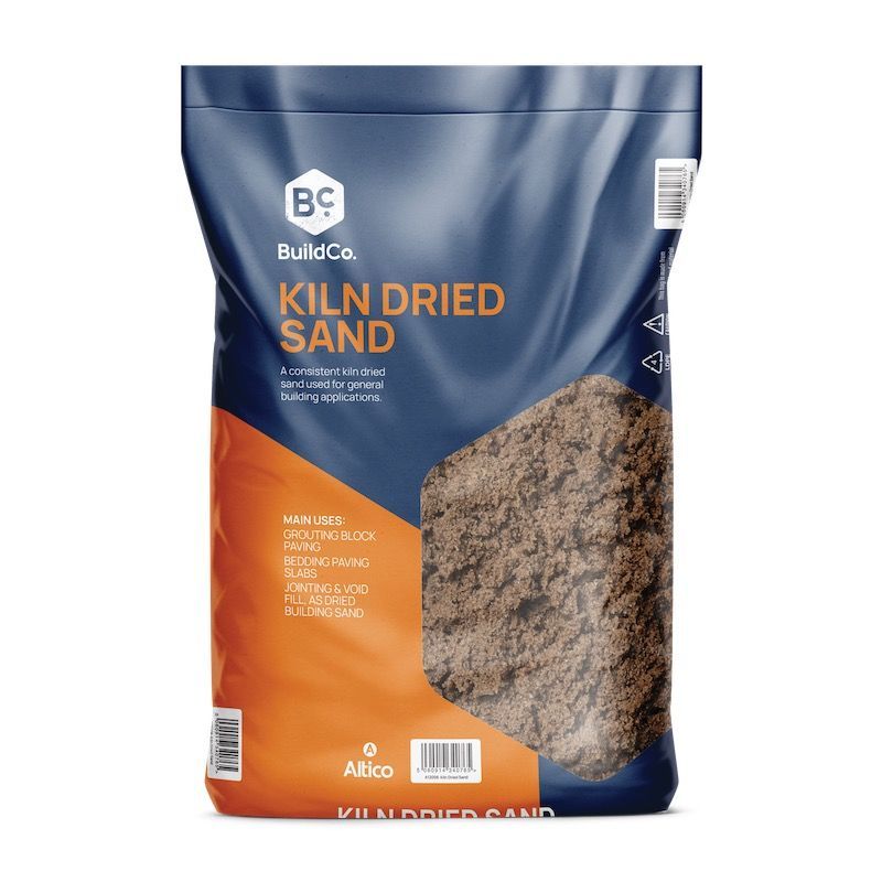 Bag of Build Co. kiln dried sand, brown sand visible through the bag, on a white background.