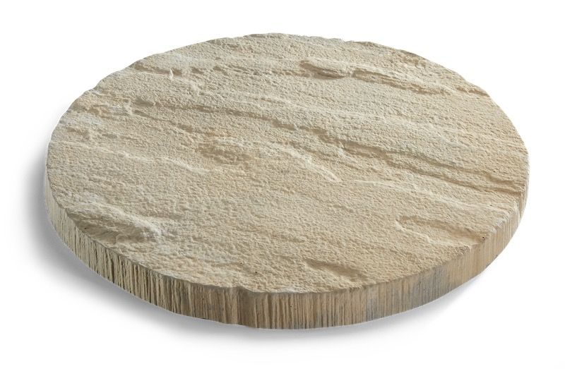 Round sandstone stepping stone, beige with textured surface and rough sides.