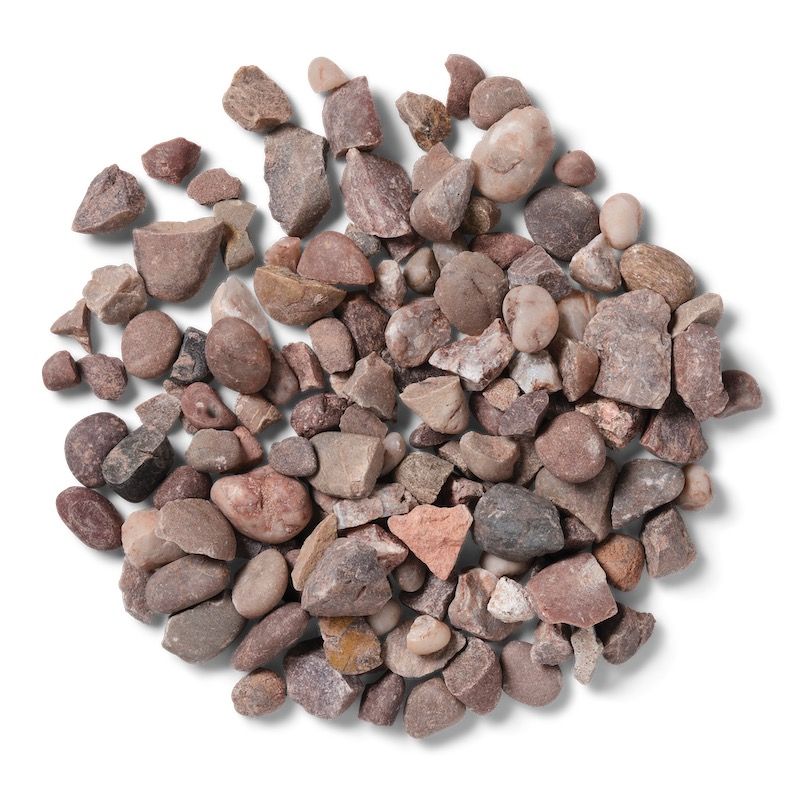 Pile of small, reddish-brown gravel rocks on a white surface.