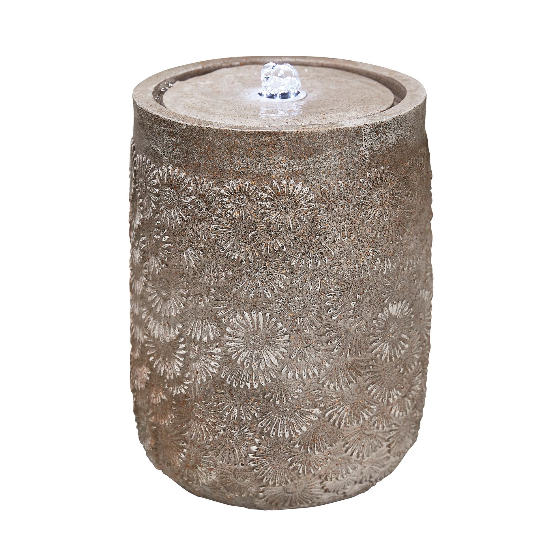 Stone-like water fountain with textured design, water bubbling from the center, indoors.