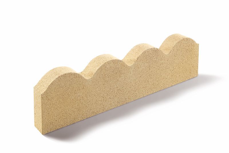 Tan, wavy-edged landscaping brick on a white background.
