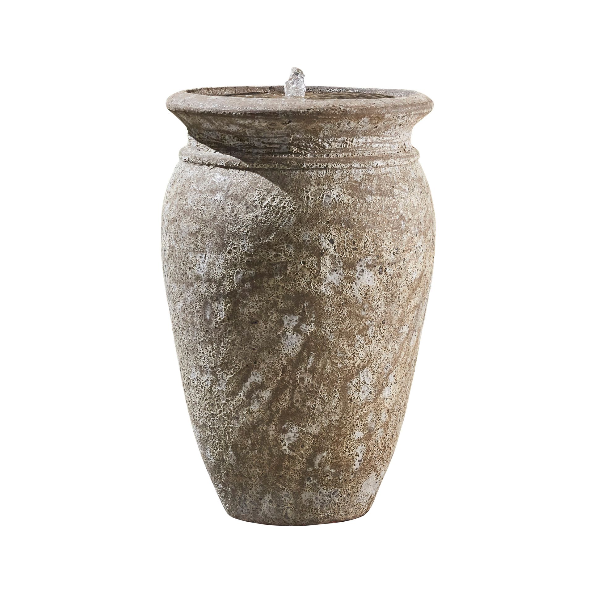Stone water fountain shaped like a textured, aged urn, with water spouting from the top.