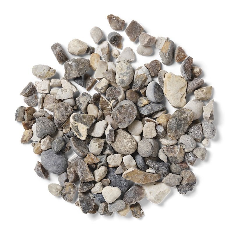 Pile of mixed gray, beige, and brown gravel stones on a white background.