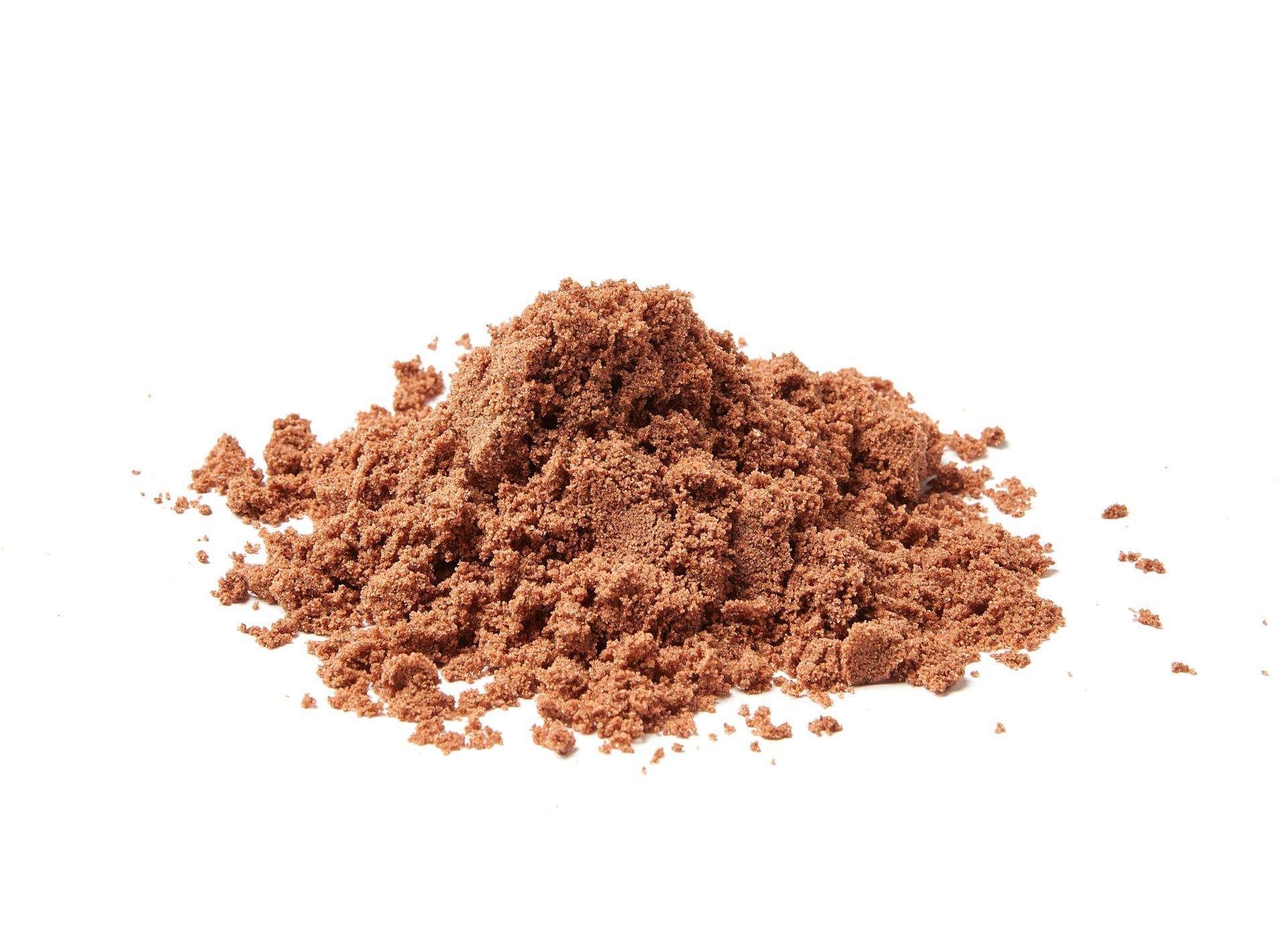 Pile of reddish-brown powder against a white background.
