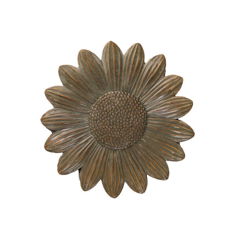 Wooden sunflower with a textured center and petals.