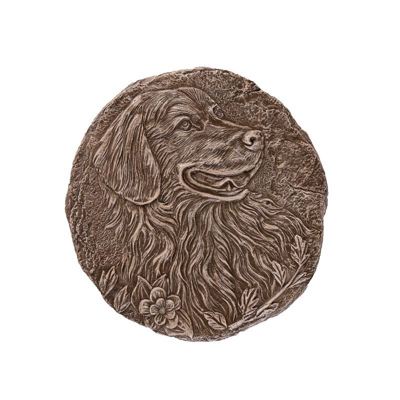 Bronze dog relief sculpture with a happy expression.