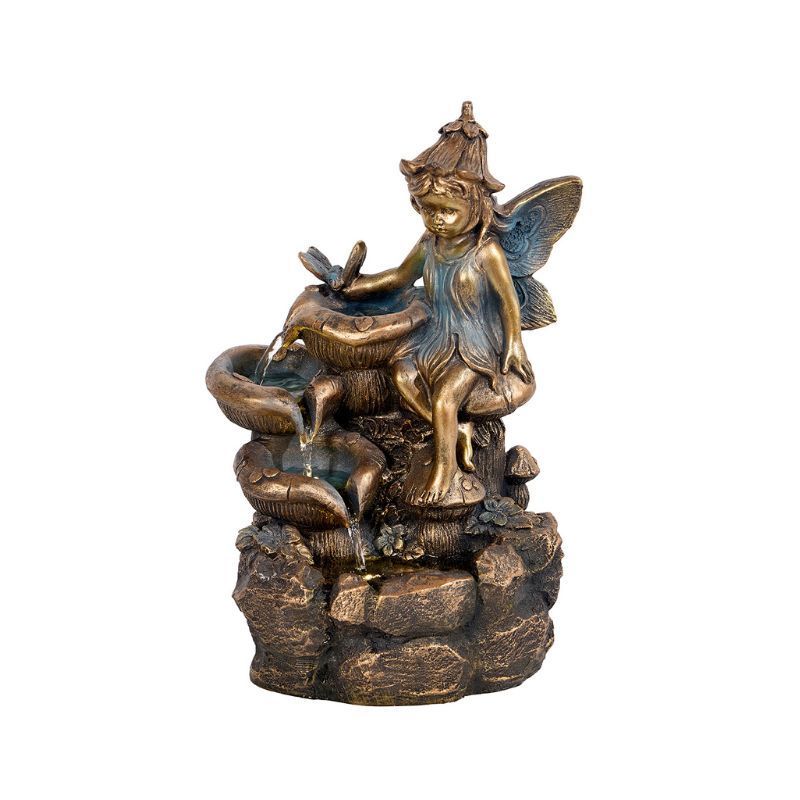 Fairy water fountain with a bronze finish, fairy sits near a waterfall.