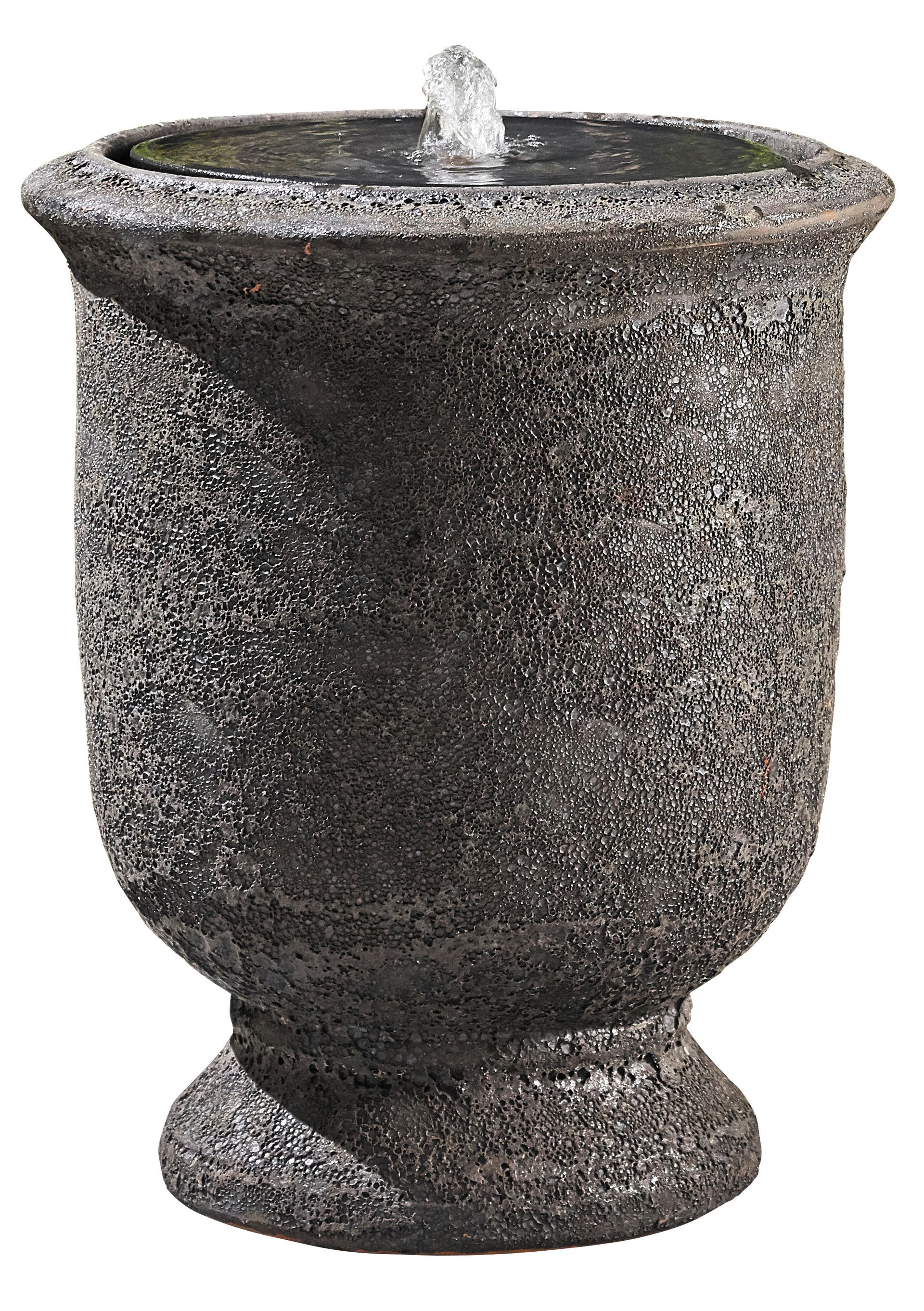 Rock-like, multi-tiered outdoor water fountain with cascading water and built-in lights.