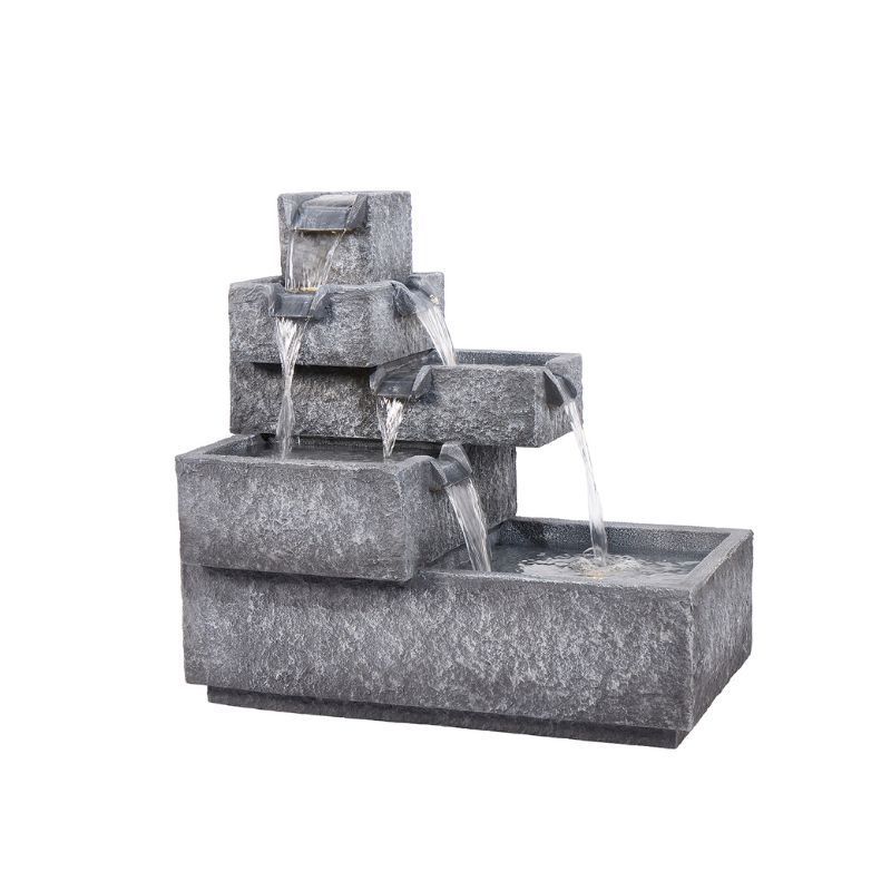 Stone-textured outdoor water fountain, cascading down rectangular tiers.