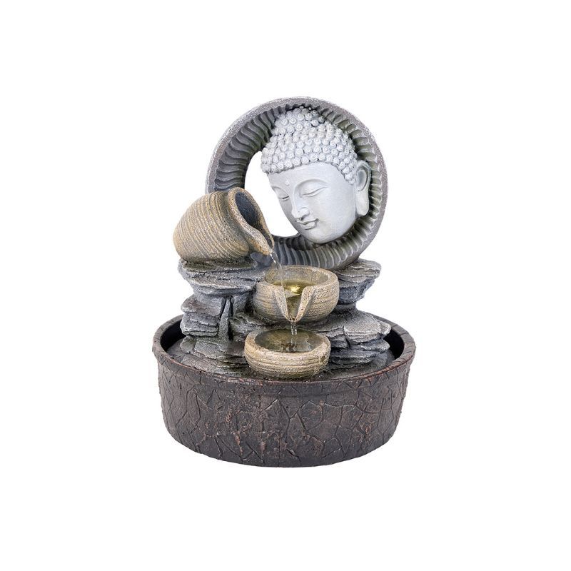 Buddha fountain with water flowing from a jug into tiered bowls, gray and brown tones.
