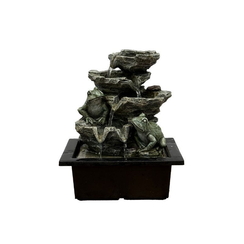 Frog fountain with stacked rock design. Water flows from top, features two frog statues.