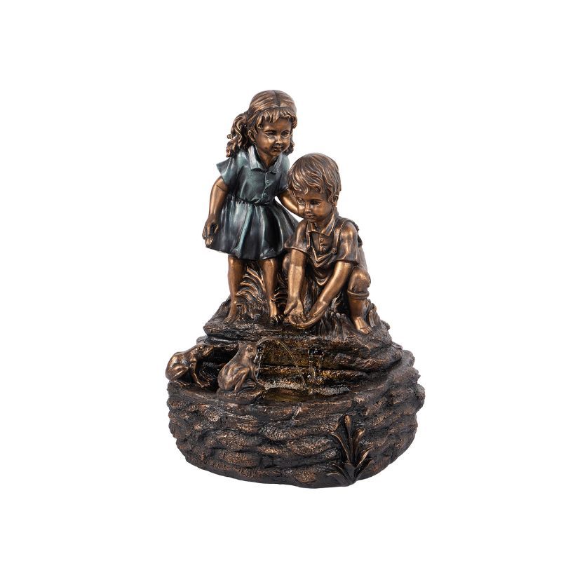 Bronze-colored fountain. Two children lean over, interacting with the water. One child stands, the other kneels.