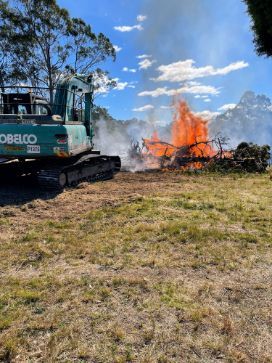 A Bulldozer Is Working On A Fire In A Field — GCE Earthworks Pty Ltd In Krambach, NSW