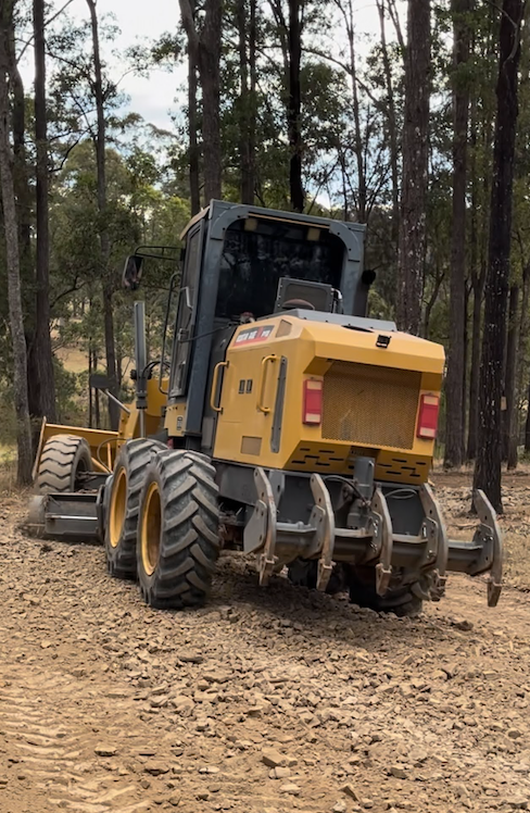 Two Men Standing In Front Of A Blue Excavator That Says See Earthwork — GCE Earthworks Pty Ltd In Krambach, NSW