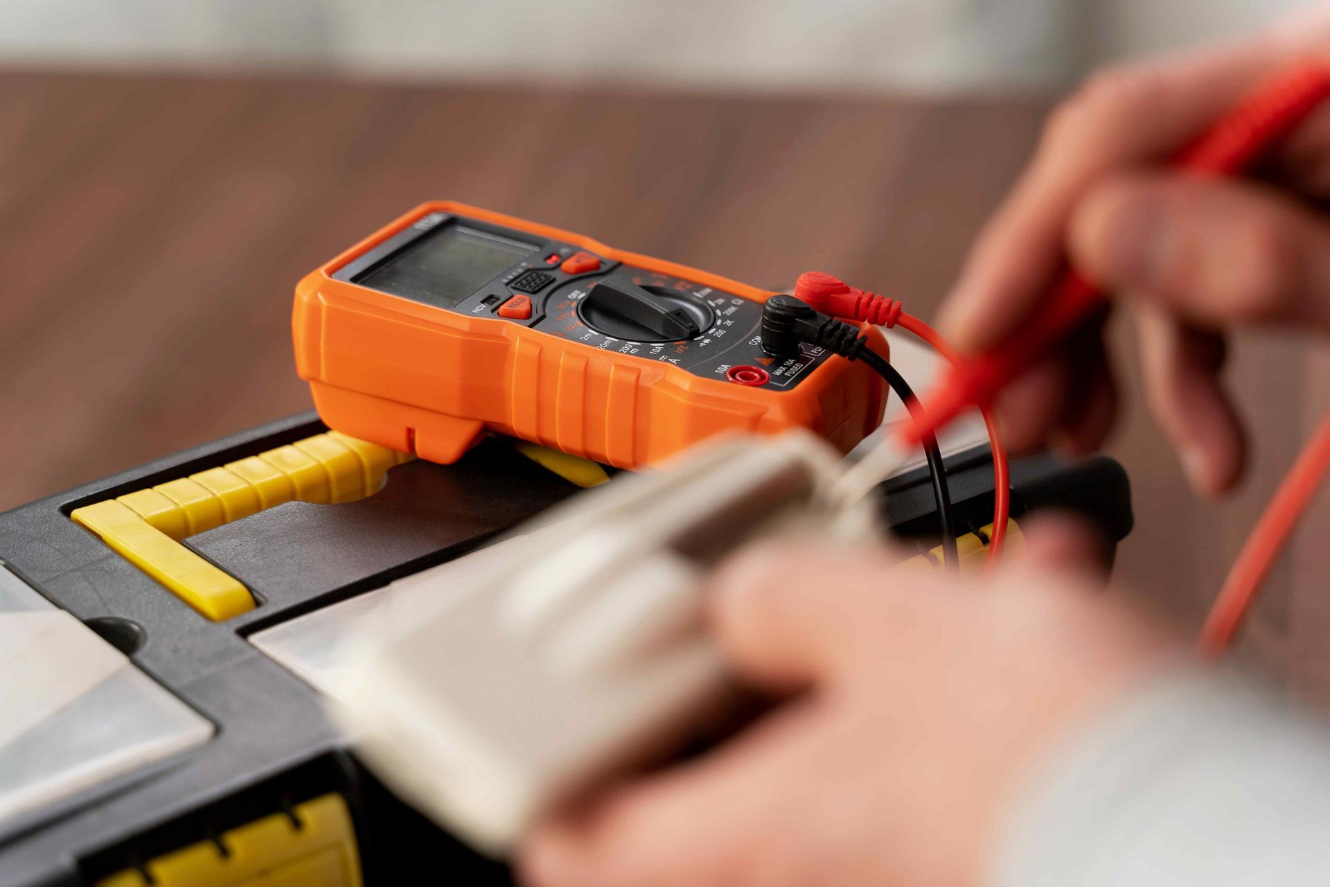 Electrician Repairing Electrical Wiring For House Using Multimeter