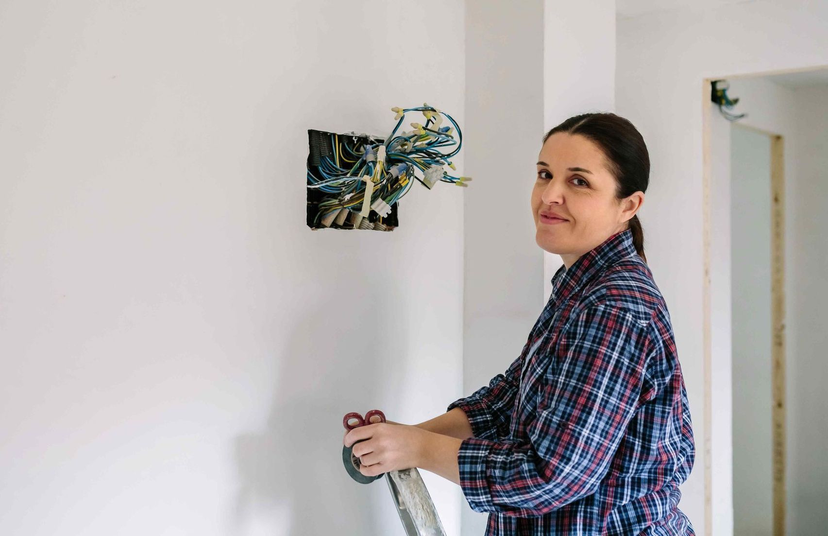 Electrician Rewiring Home Electrical System Inside House