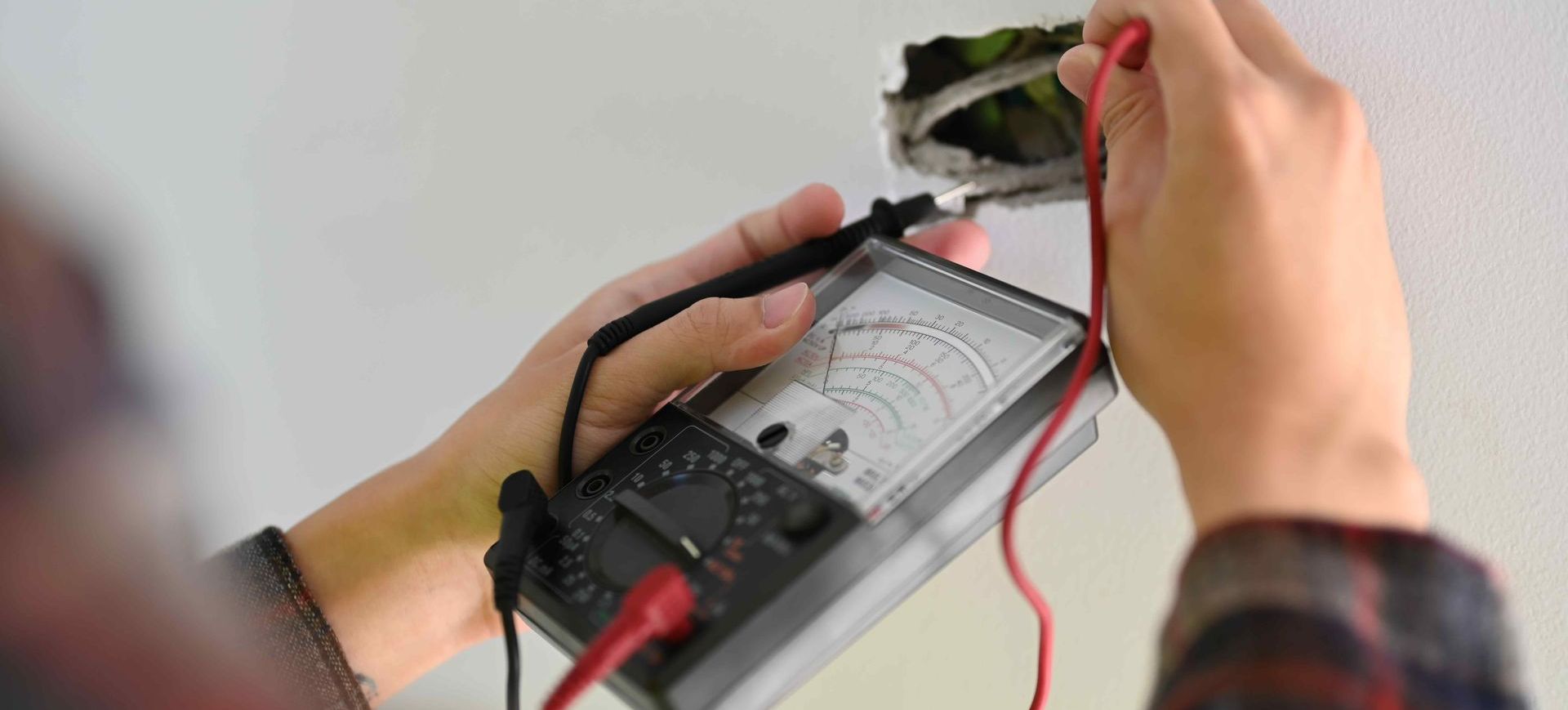Electrician Testing Electrical Lines For Integrity In Home For Sale