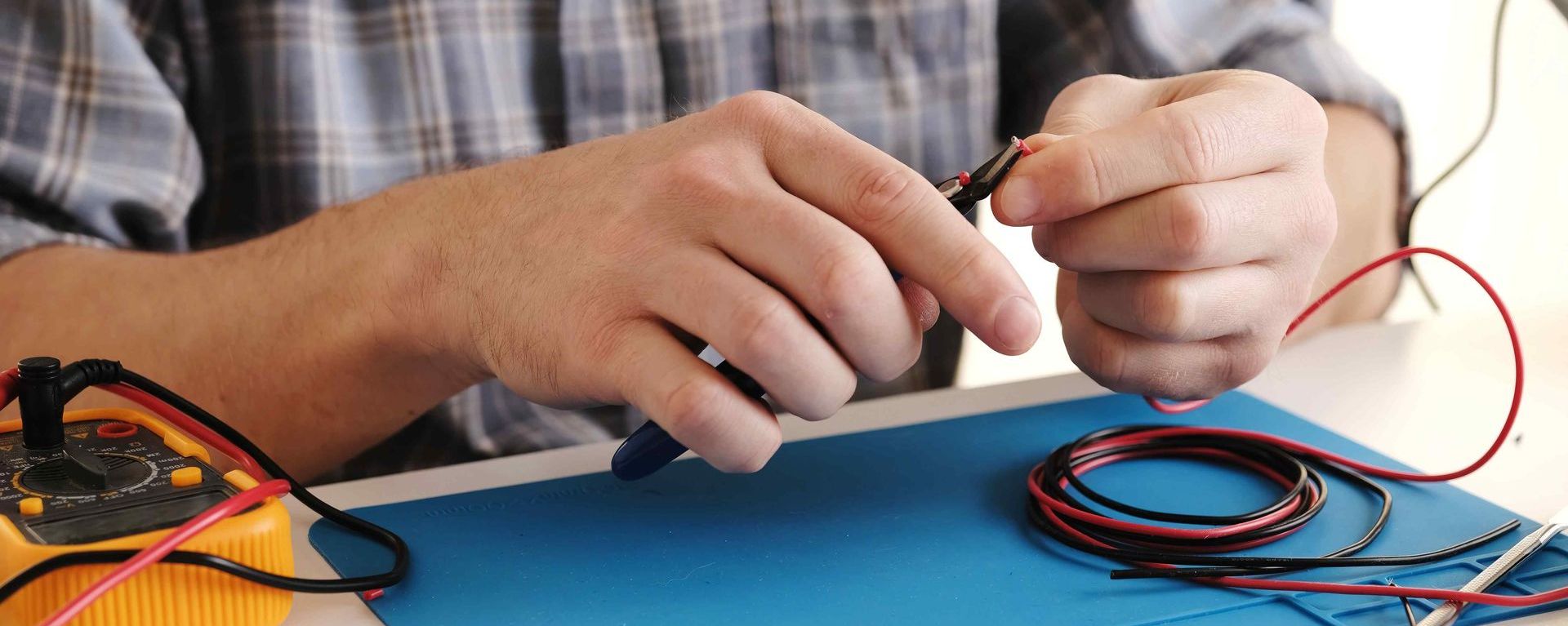 Affordable Master Electrician Preparing Electrical Wires for Rewiring Project