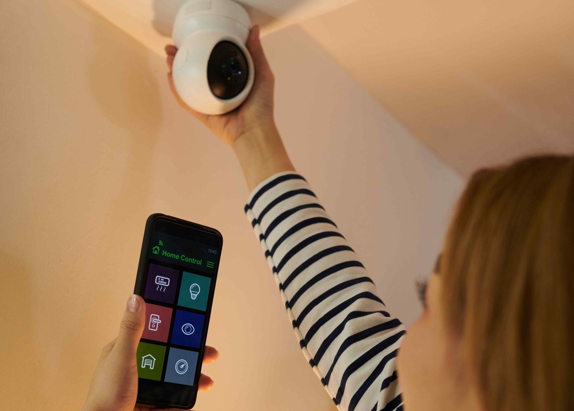Woman Accessing Security Camera With Smart Home App