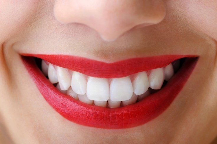 Woman with red lips and white teeth