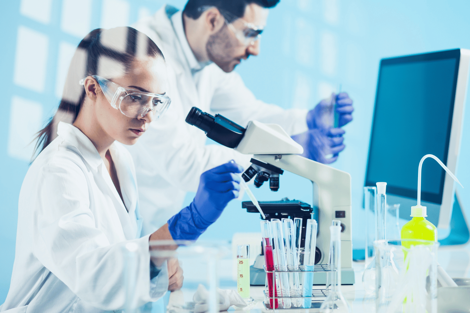 life science team working in lab and on validation software