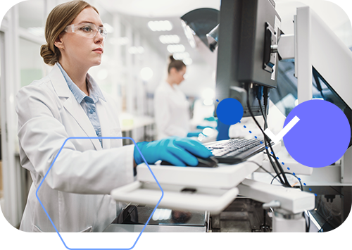 A female scientist is working on a computer in a laboratory.