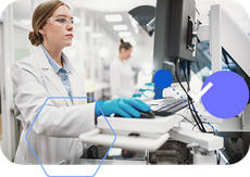 A female scientist is working on a computer in a laboratory.