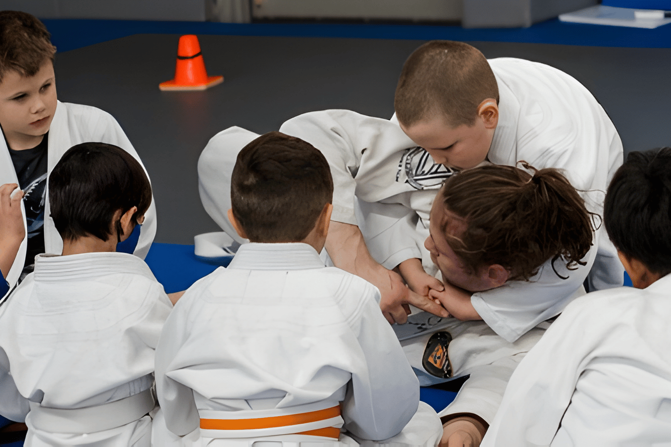 Beginner students drilling Brazilian Jiu-Jitsu escapes at The Academy Eden Prairie in Minneapolis.