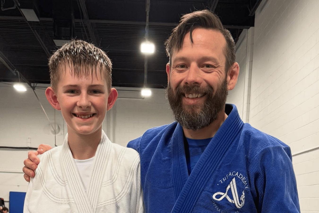 Students drilling Brazilian Jiu-Jitsu escapes at The Academy Eden Prairie in Minneapolis, MN.