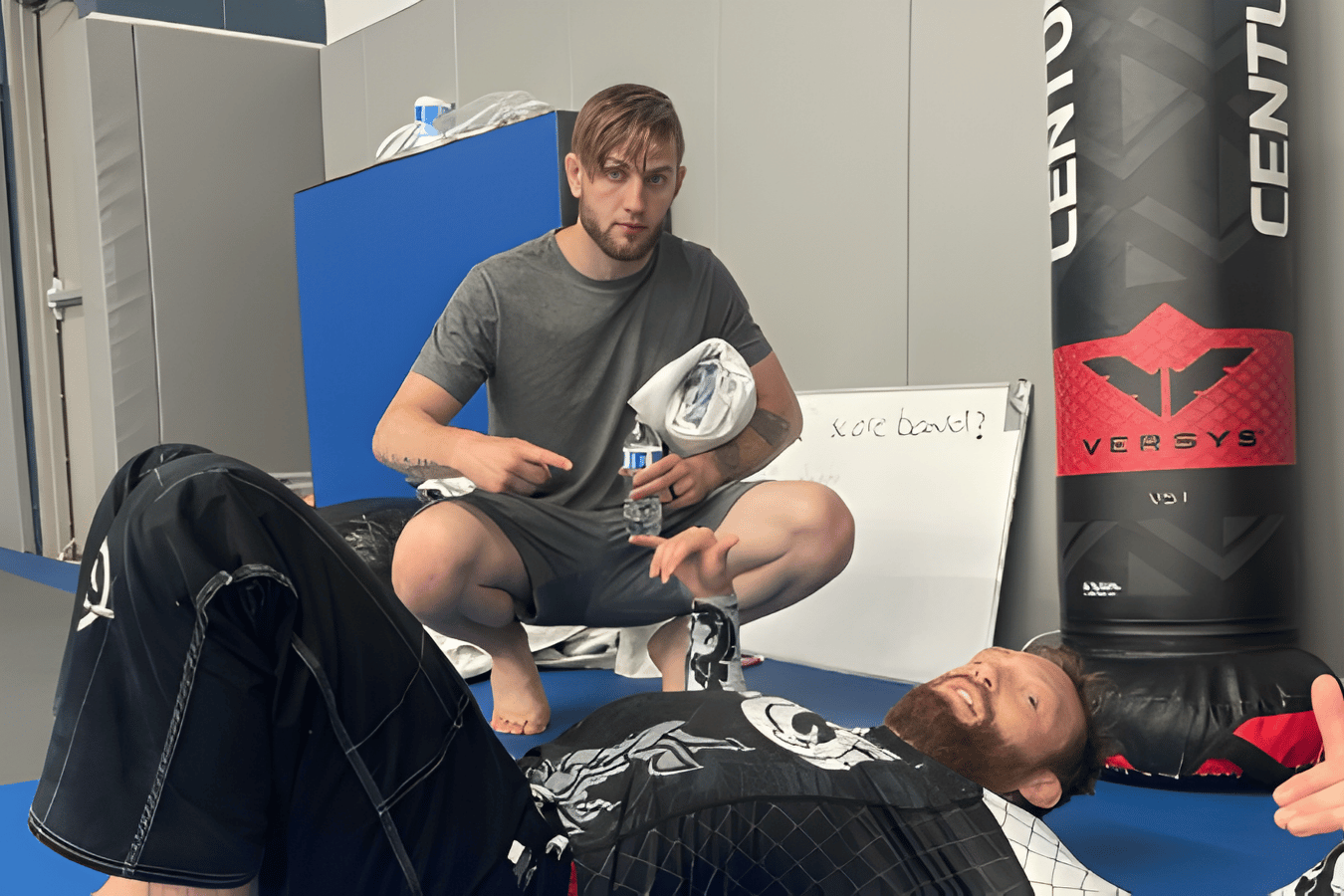 Adults drilling Brazilian Jiu-Jitsu sweeps at The Academy Eden Prairie in Minneapolis, MN.