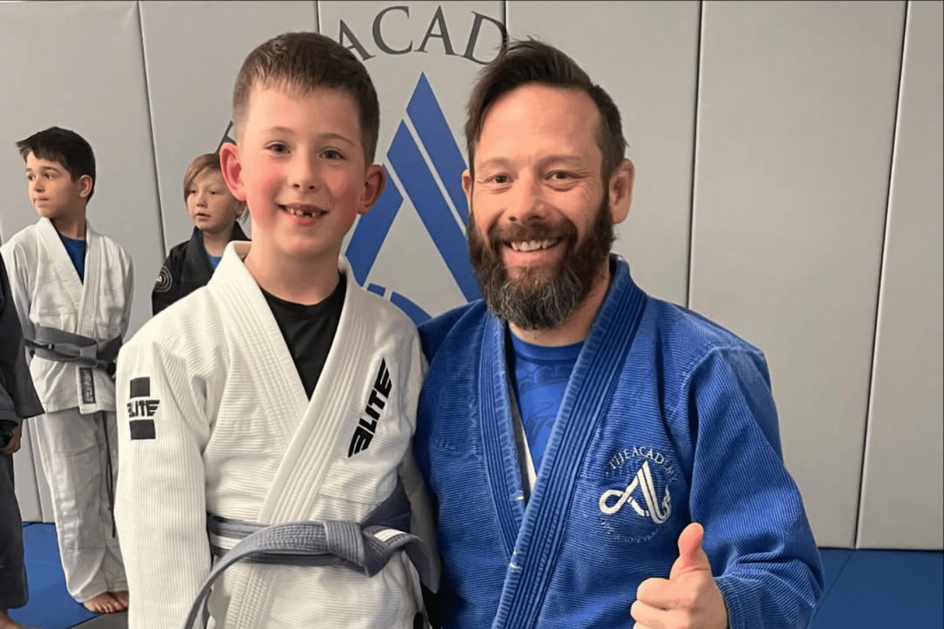 Kids and adults drilling Brazilian Jiu-Jitsu at The Academy Eden Prairie in Minneapolis, MN.