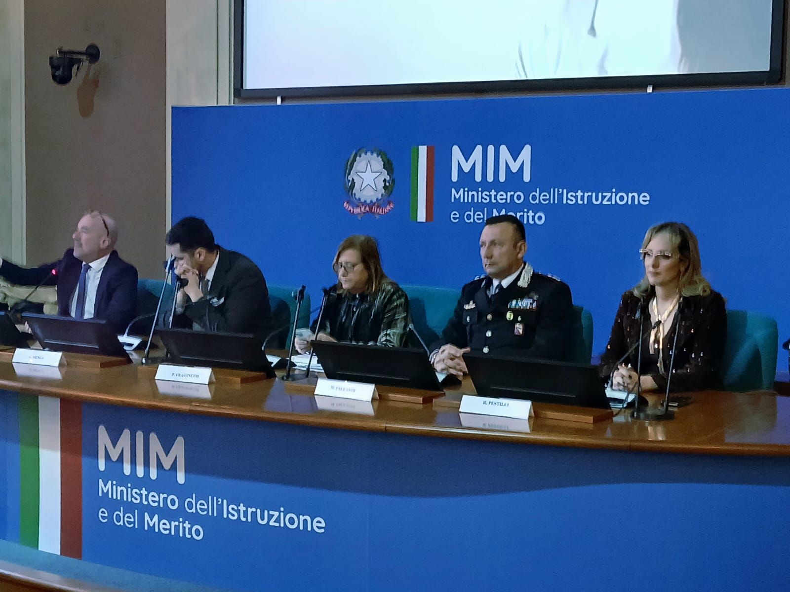 Relatori seduti al tavolo di presidenza durante la presentazione del libro 'Il delitto di Saman Abbas' presso il Ministero dell'Istruzione e del Merito (MIM) a Roma