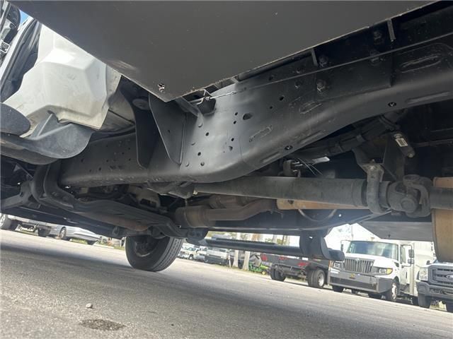 A truck is parked on the side of the road.