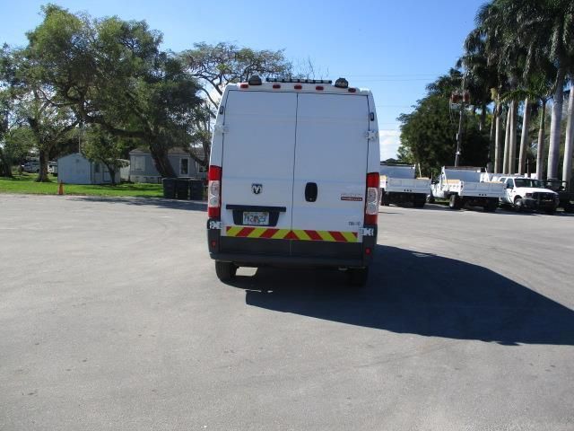 A white van is parked in a parking lot