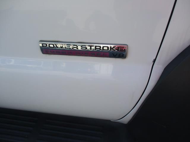 A white truck has a power stroke emblem on the side