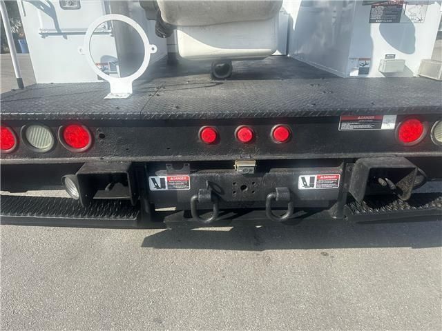 The back of a truck with red lights on it