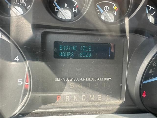 The dashboard of a car shows that the engine is idle