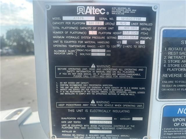 A black and white plaque that says altec on it
