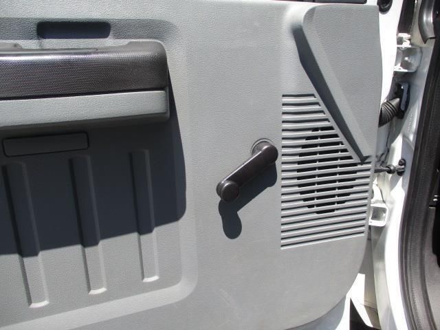 A close up of a car door with a black handle