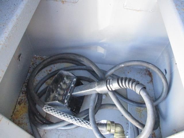 A bunch of wires are laying in a white box