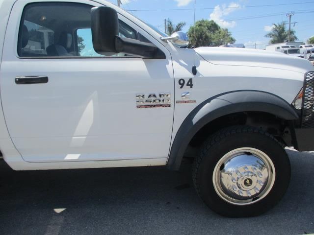 A white truck with the number 94 on the side