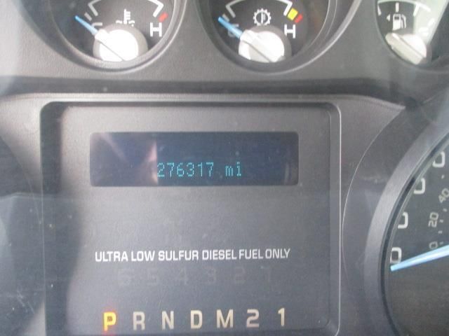 A close up of a car dashboard that says ultra low sulphur diesel fuel only