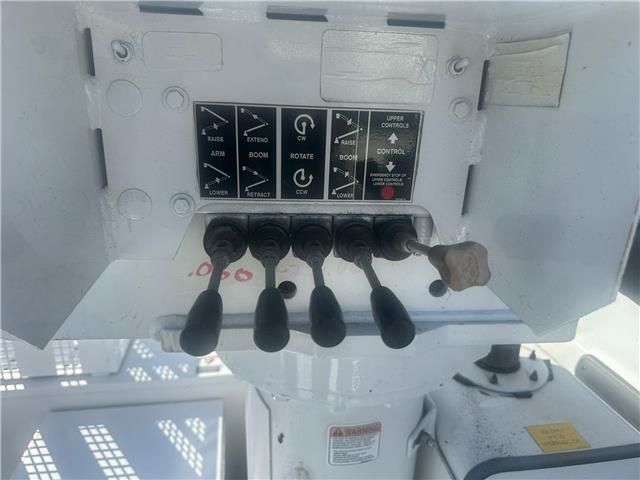 A close up of a control panel on a white vehicle