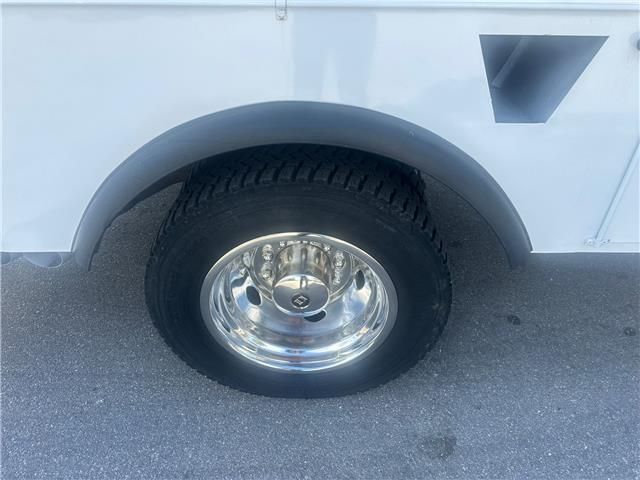 A close up of a tire on a white truck